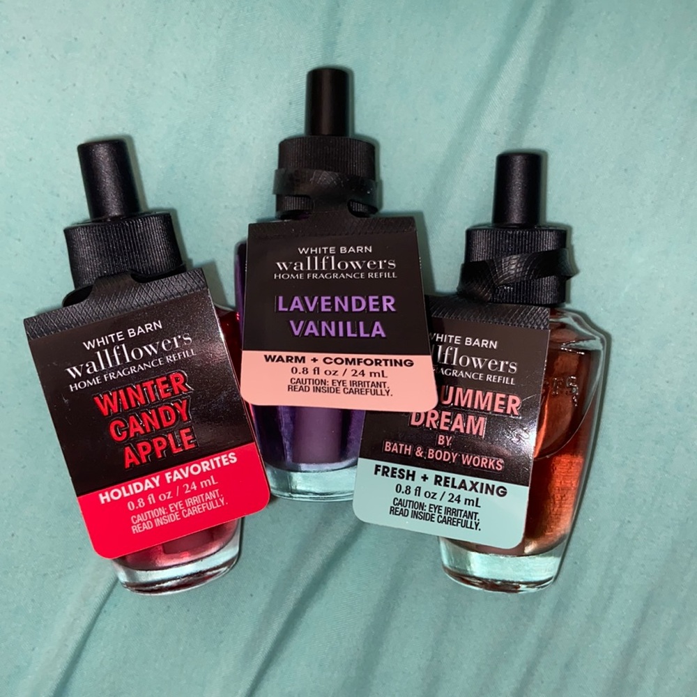 Three bath and body works wall flower scents